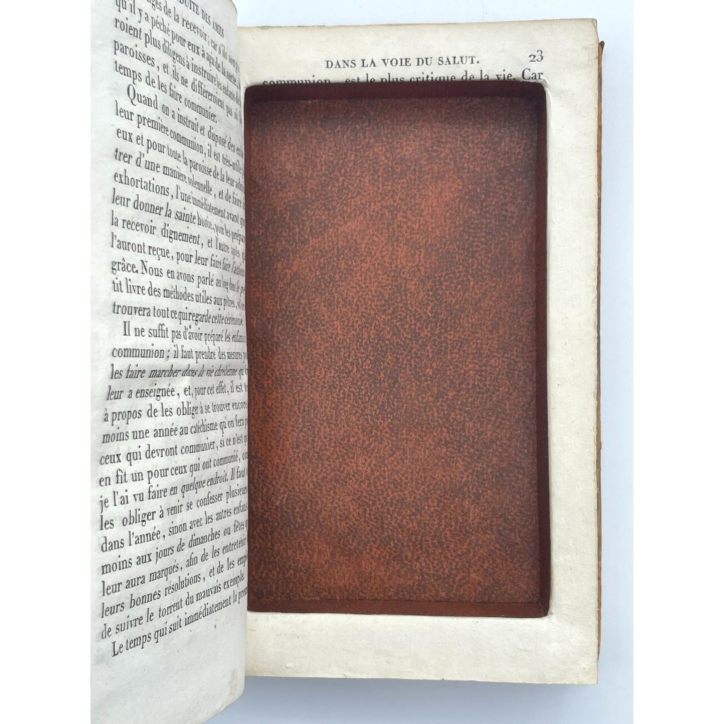 [Book safe made from book "Conduite des âmes dans la voie du salut" in armorial binding]