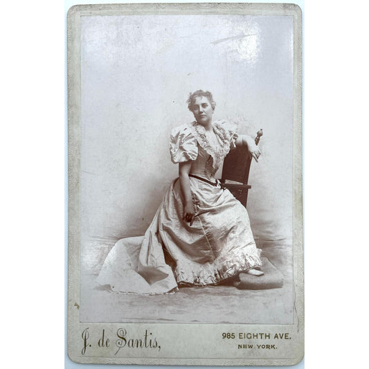 [Cabinet card of woman in a dress in New York City]